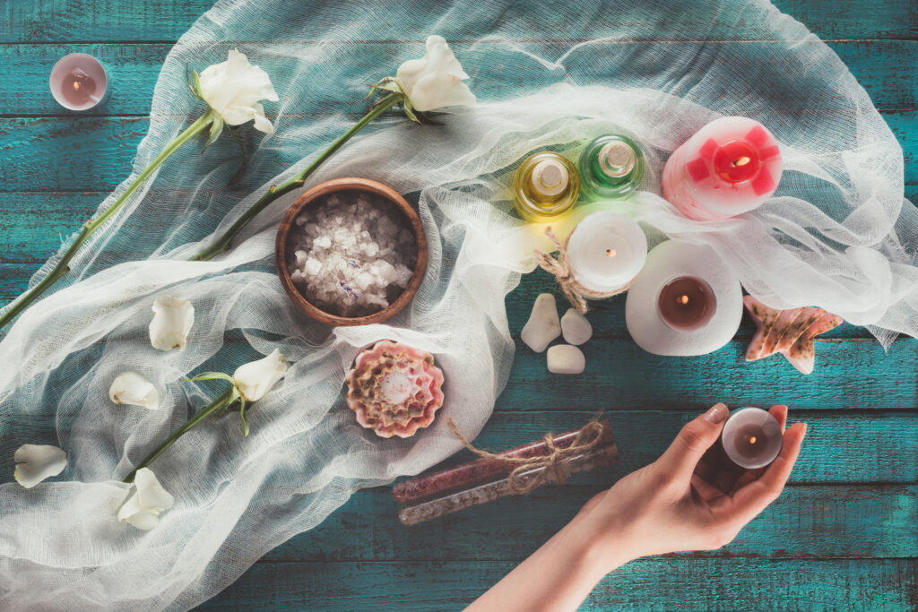 Top View Of Woman Making Spa Treatment Decoration, Holding Candle