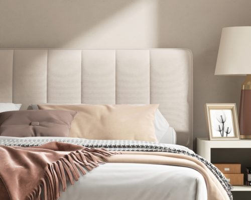 Modern,cream,colored,bed,with,bedside,table,,lamp,in,minimal,